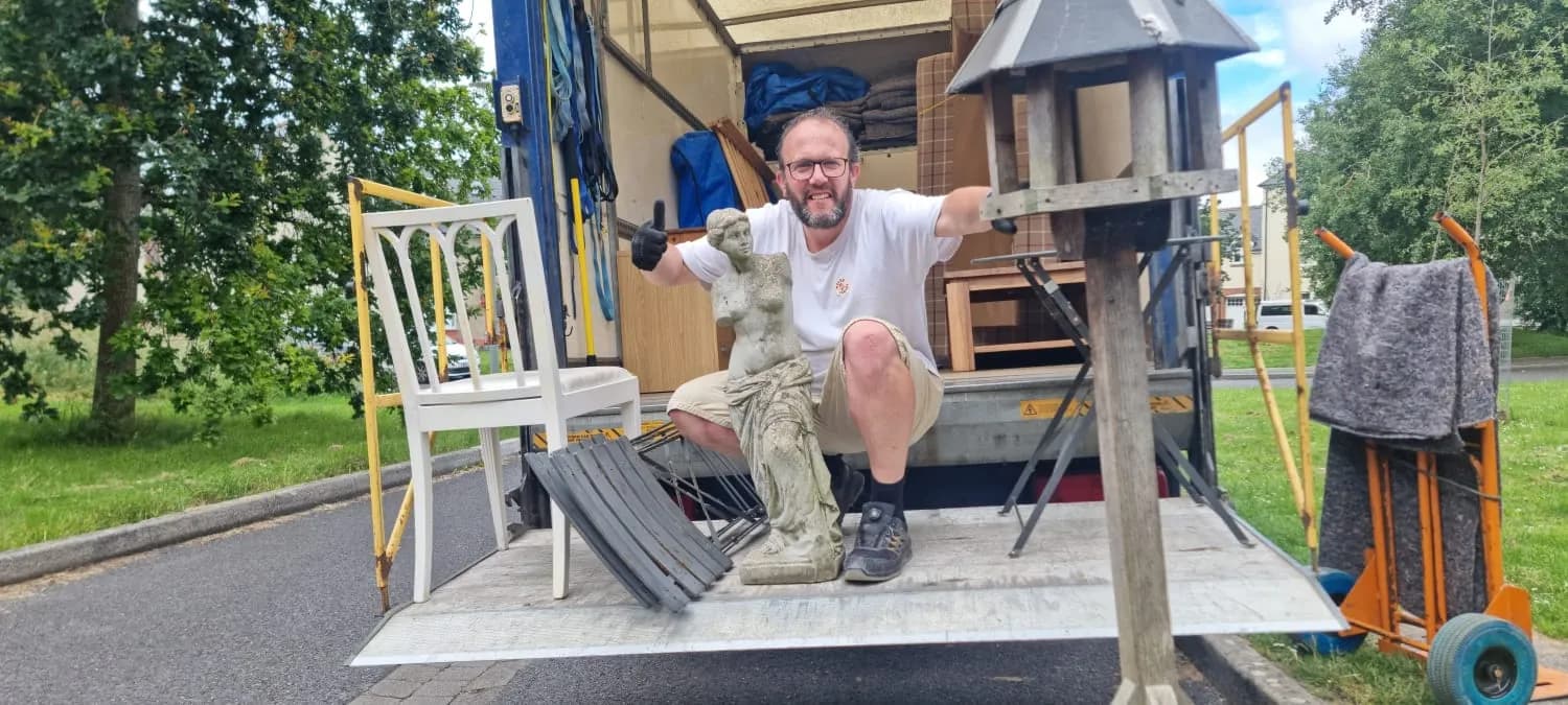 Carefully loading items onto the van tail-lift